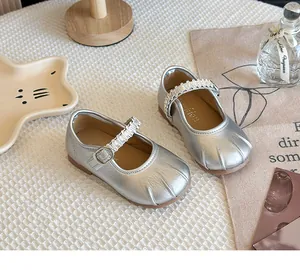Elegant silver Mary Jane leather shoes for girls featuring a pearl strap detail