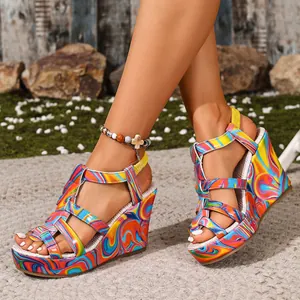Vibrant psychedelic print wedge sandals with multi-strap design and open toe focus