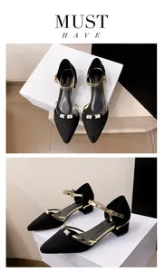 Detailed view of black pointed-toe Mary Jane pumps featuring block heels and rhinestones