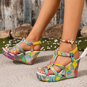 Detailed view of colorful marble pattern wedge sandals with platform open toe design.
