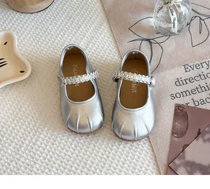 Top view of silver Mary Jane shoes for girls with sparkling crystal straps in French style