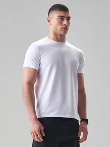 Detailed view of a men's plain white cotton crew neck t-shirt on a male model