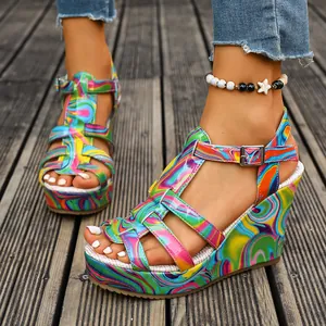 Detail of vibrant multi-color wedge sandals with ankle strap and platform sole.
