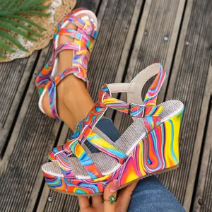 Macro view of colorful marble print on platform wedge sandals with woven texture