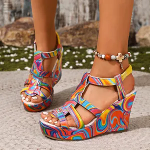 Close-up detail of vibrant colorful psychedelic pattern wedge sandals with multi-strap design