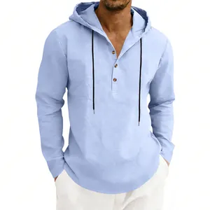 Close-up of texture and button detail on light blue men's casual linen hooded Henley shirt