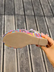 Macro view of non-slip sole and size mark on colorful platform wedge sandals