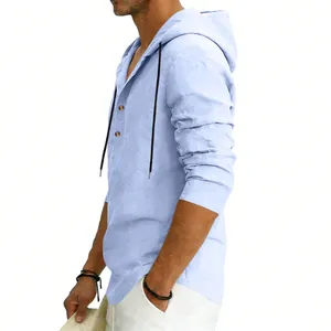 Side view of a breathable light blue men's linen hooded henley shirt for beach wear