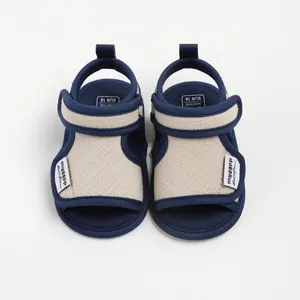 Soft navy blue and beige cotton baby walking sandals with adjustable velcro straps