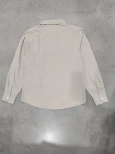 Back view of a minimalist beige linen long sleeve shirt for men with turn-down collar