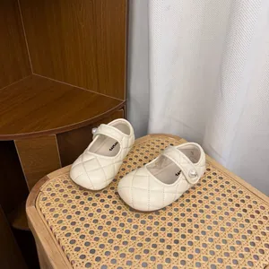 Elegant cream quilted Mary Jane shoes for girls with pearl button detail and soft sole