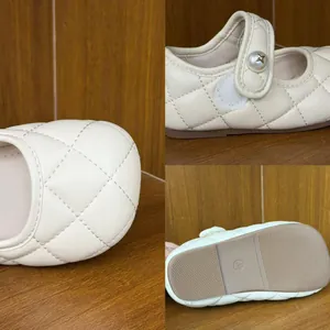 Detailed view of quilted cream kids' Mary Jane shoes focusing on sole and texture