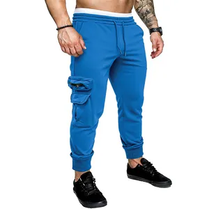 Close-up of blue men's cargo joggers featuring multi-pocket design and drawstring
