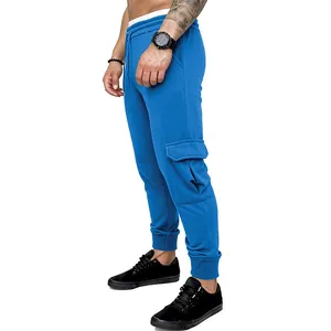Detailed side view of blue men's cargo joggers with large side pocket and elastic cuff