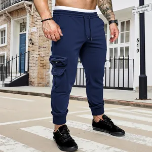 Men's navy blue multi-pocket cargo sweatpants with drawstring and ribbed cuffs.