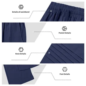Detailed macro view of waistband, pocket, and pleats on these navy blue linen trousers.
