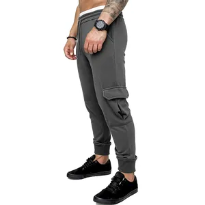 Side profile detail of men's dark grey cargo joggers showing the cargo pocket and slim fit cut