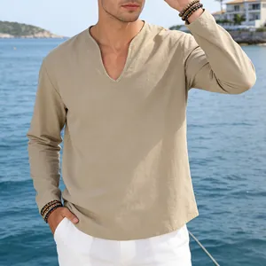 Close-up of khaki linen V-neck shirt showing relaxed fit and natural fabric texture