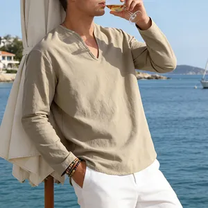 Close-up of a men's khaki linen V-neck long sleeve T-shirt in a seaside setting