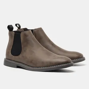 Men's vintage brown Chelsea boots in a classic British style with a smooth finish.