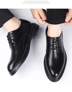 Detailed top view of black perforated men's formal business leather shoes