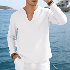 Close-up of men's casual white linen long-sleeve V-neck t-shirt by the sea.