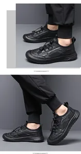 Detailed view of fashionable black breathable mesh outdoor casual sneakers for men