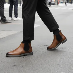Street style view of vintage brown leather Chelsea boots for men with elastic side.