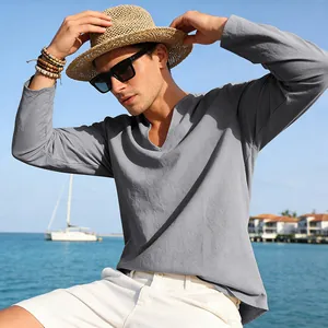 Close-up detail of men's grey linen long-sleeve shirt with a notched V-neck design
