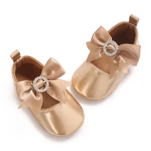 Champagne baby walker shoes with elegant silk bow and rhinestone buckle detail