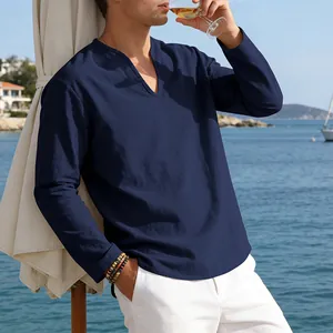 Casual navy blue linen long sleeve V-neck shirt for men in a scenic seaside setting
