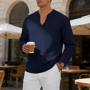 Casual navy blue V-neck linen shirt for men shown in an outdoor cafe lifestyle setting