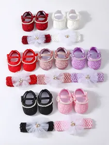 Detailed display of colorful baby princess lace shoes with matching pearl flower headbands