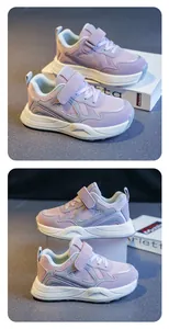 Detailed view of purple breathable girls' sports sneakers with mesh and Velcro strap