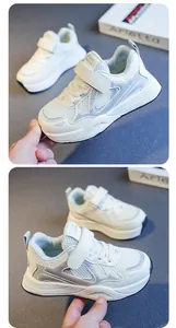 Detailed macro view of white girls' breathable sneakers with mesh and velcro