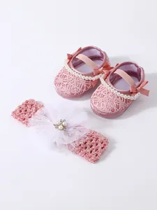 Pink lace baby princess shoes and matching headband set with pearls and decorative bows