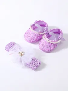 Elegant lavender lace baby girl shoes and matching headband set with pearls and satin bows