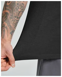 Close-up of black seamless sports tank top showing high elasticity and breathable fabric