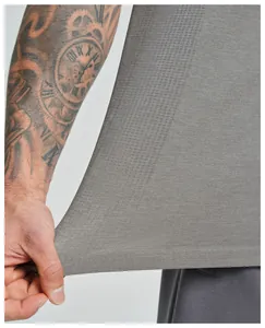 Detail shot of men's seamless quick-dry sports vest showing breathable mesh fabric texture.