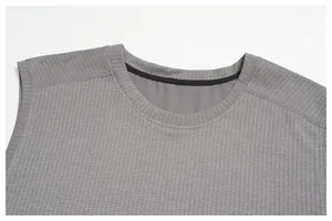Close-up of the neckline and breathable mesh fabric of a grey men's sports tank top.