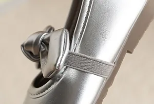 Detail of silver girls princess shoe featuring a delicate bow and comfortable strap.