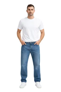 Full length view of men's loose straight-leg blue jeans styled with white t-shirt