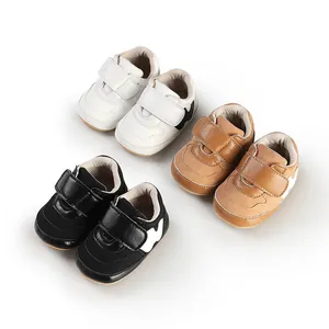 Multiple colors of baby boy sneakers with velcro straps for infants aged 0-1 year.