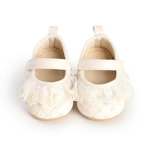 Soft cream baby girl walking shoes featuring elegant lace frills and a quilted design
