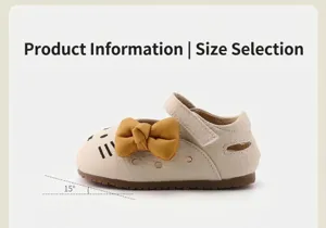 Detail of toddler girl walking shoes with cartoon cat design and yellow bow knot