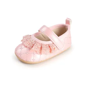 Side view of pink lace baby princess shoe with quilted pattern and hook-loop strap