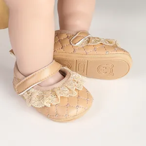Detailed view of beige lace baby walking shoes with quilted faux leather