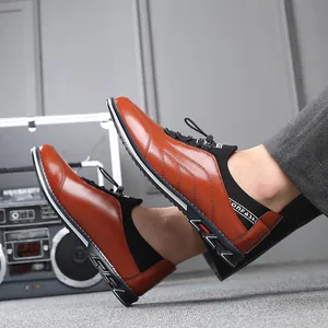 Close-up view of brown leather men's slip-on casual shoes with stylish sole detail.