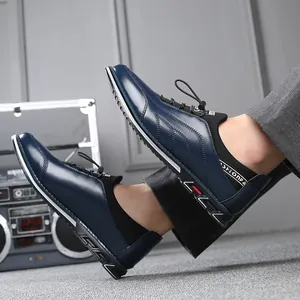 Detail showing navy blue leather finish and elastic collar of men's slip-on shoes