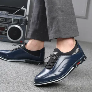 Navy blue low-top casual leather shoes for men with embroidered details